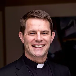 professional portrait photo of Fr. Brogan
